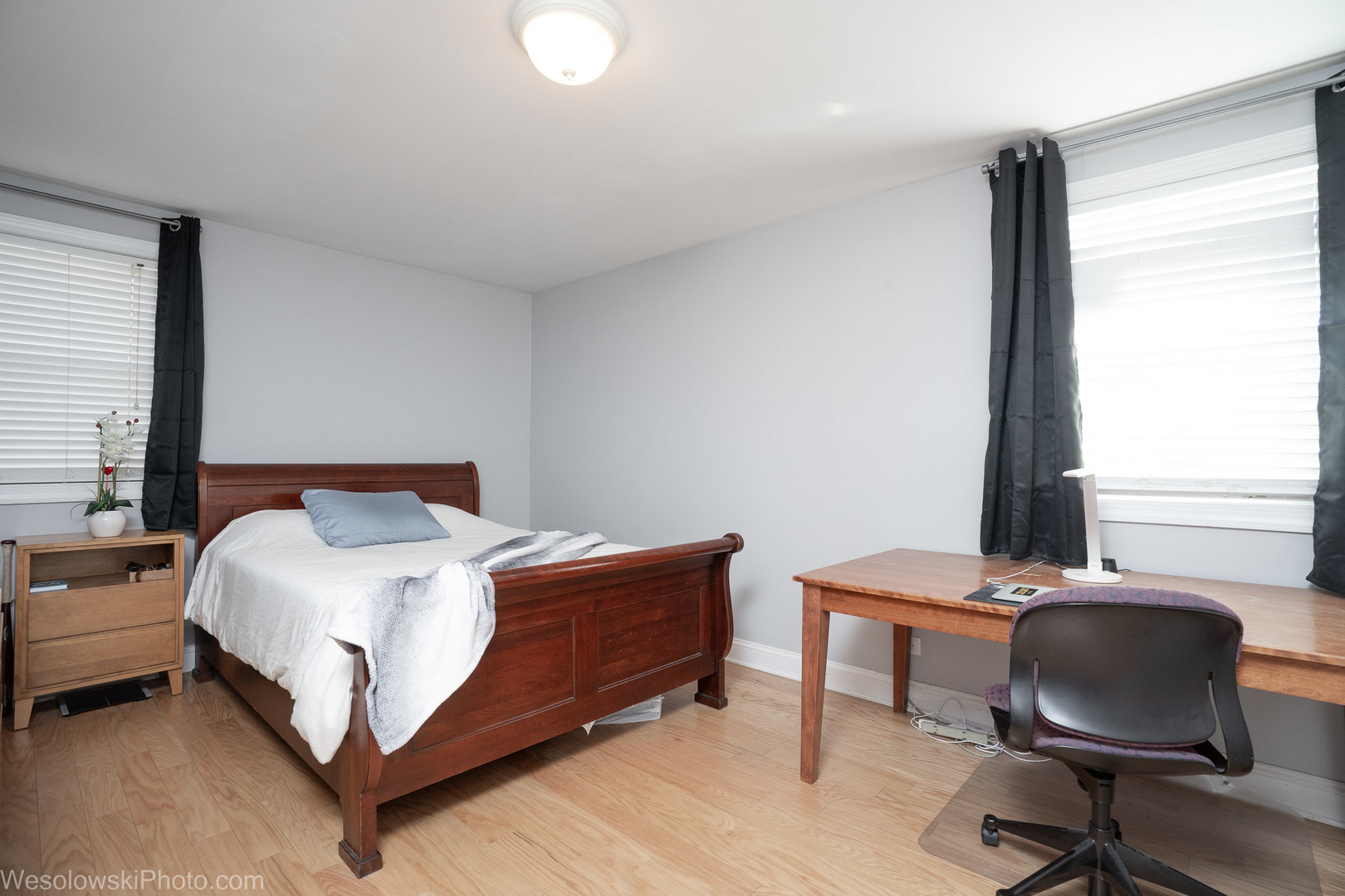 1288 Perry Street, Unit P1 Des Plaines, IL 60016 - Photo 7 of 13 a bedroom with a bed and a chair