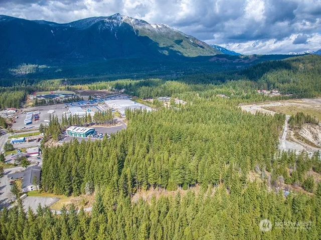 a view of a water pond with green field