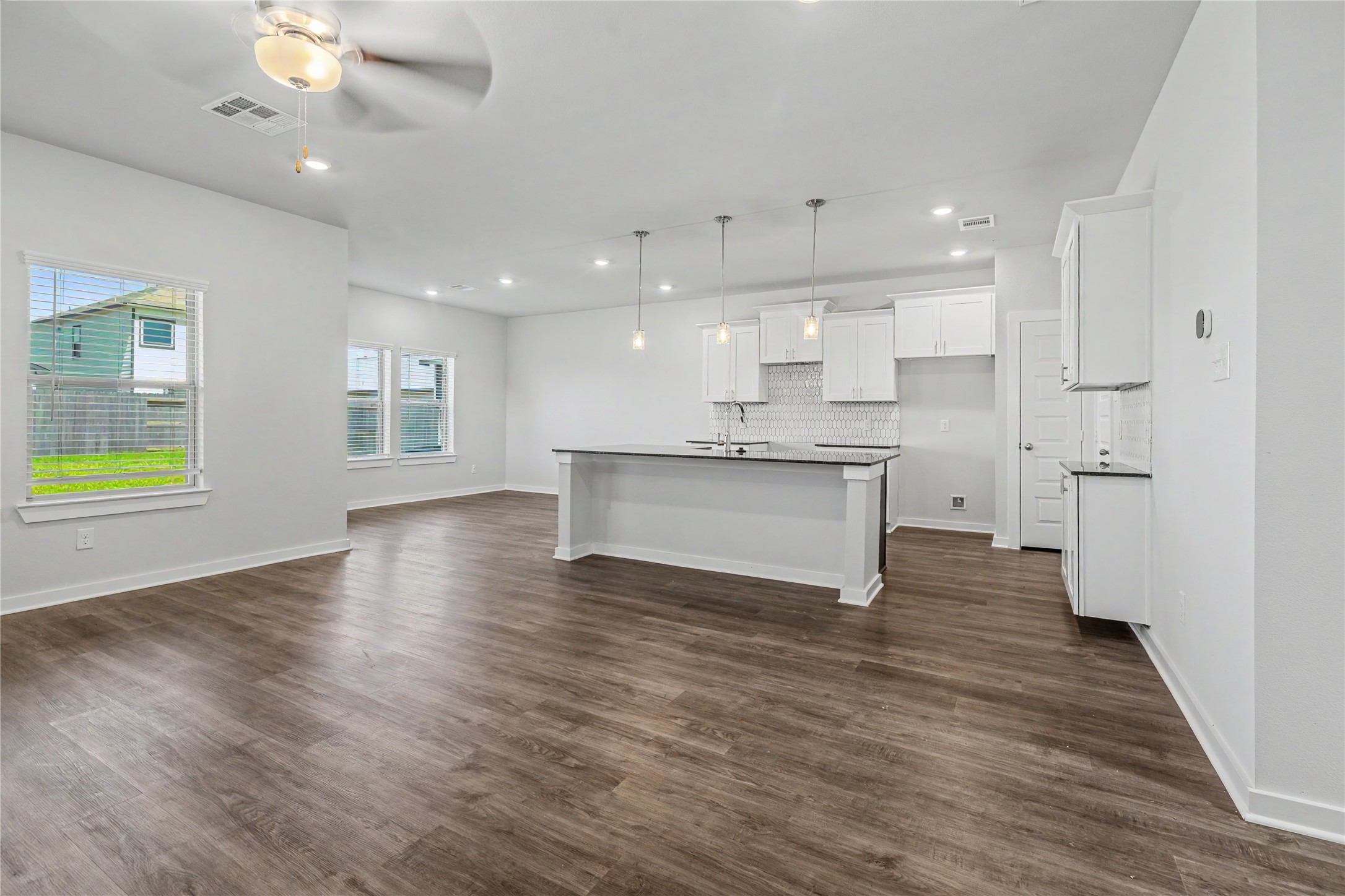 6426 Bolinas Court Rosharon, TX 77583 - Photo 18 of 49 a view of kitchen with stove and wooden floor
