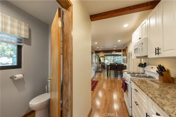 a kitchen with a sink appliances and a counter top space