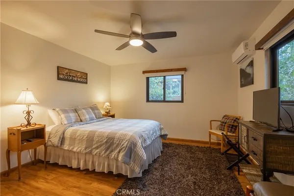 a bedroom with a bed and a walk in closet