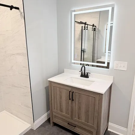 a bathroom with a sink and a mirror