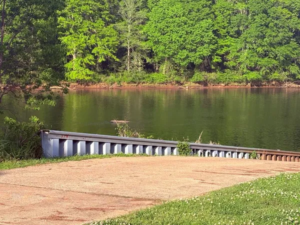 a view of a grassy field with mountain