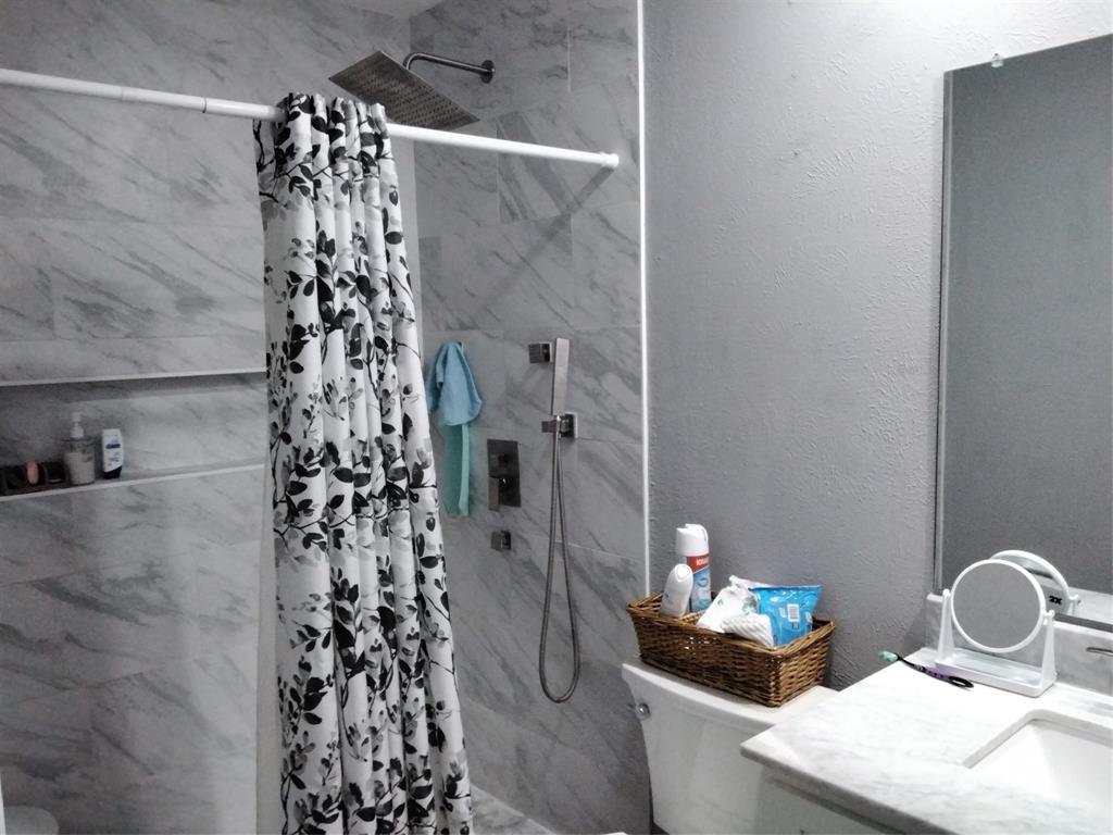 5036 Arbor Glen Road The Colony, TX 75056 - Photo 13 of 29 a bathroom with a sink toilet and shower