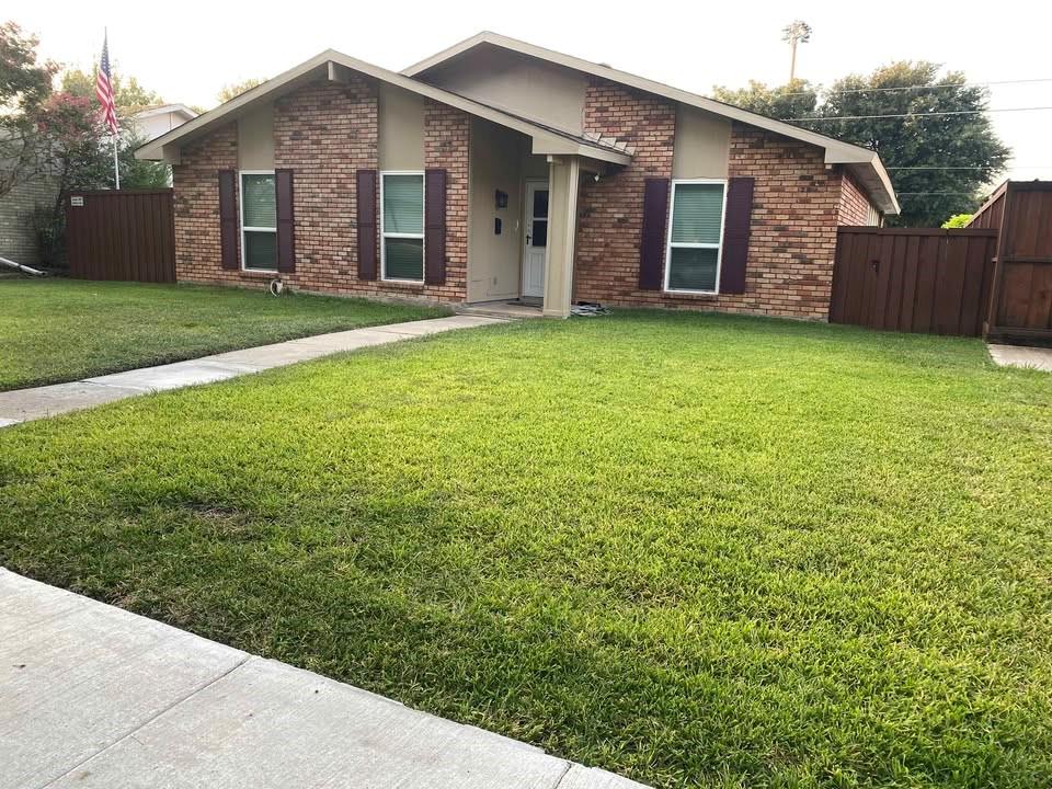 5036 Arbor Glen Road The Colony, TX 75056 - Photo 2 of 29 a view of a house with a yard and fence