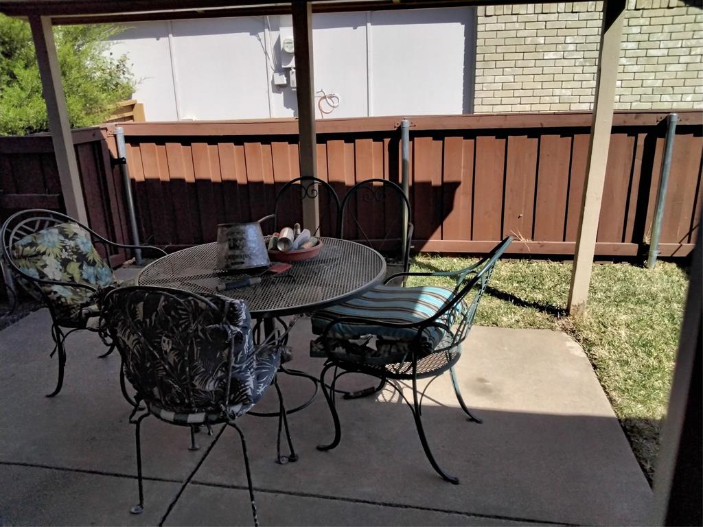 5036 Arbor Glen Road The Colony, TX 75056 - Photo 22 of 29 a view of a table and chairs in patio