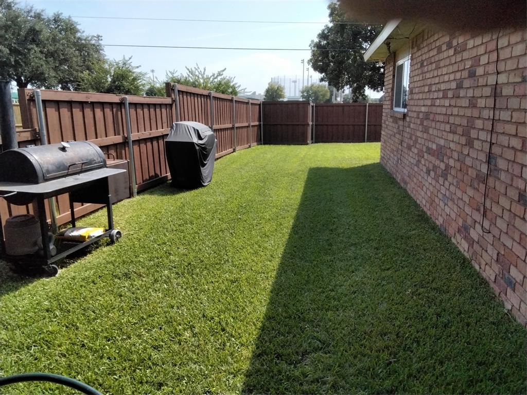 5036 Arbor Glen Road The Colony, TX 75056 - Photo 24 of 29 a view of a backyard with wooden fence