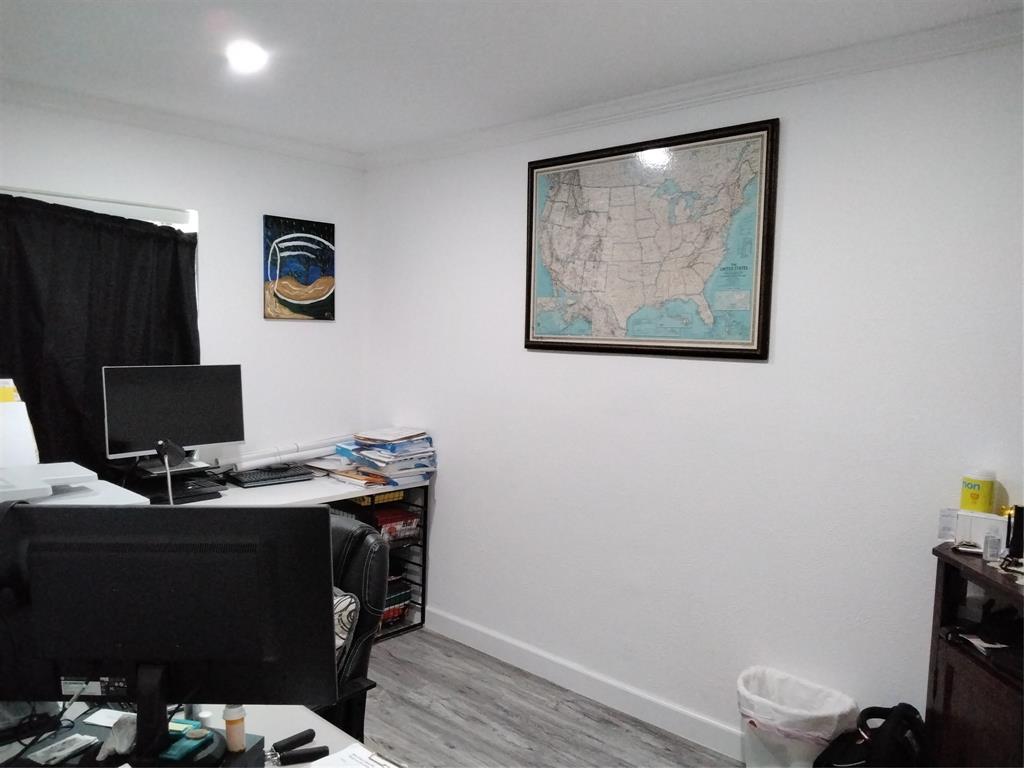 5036 Arbor Glen Road The Colony, TX 75056 - Photo 4 of 29 a view of a workspace with furniture and wooden floor