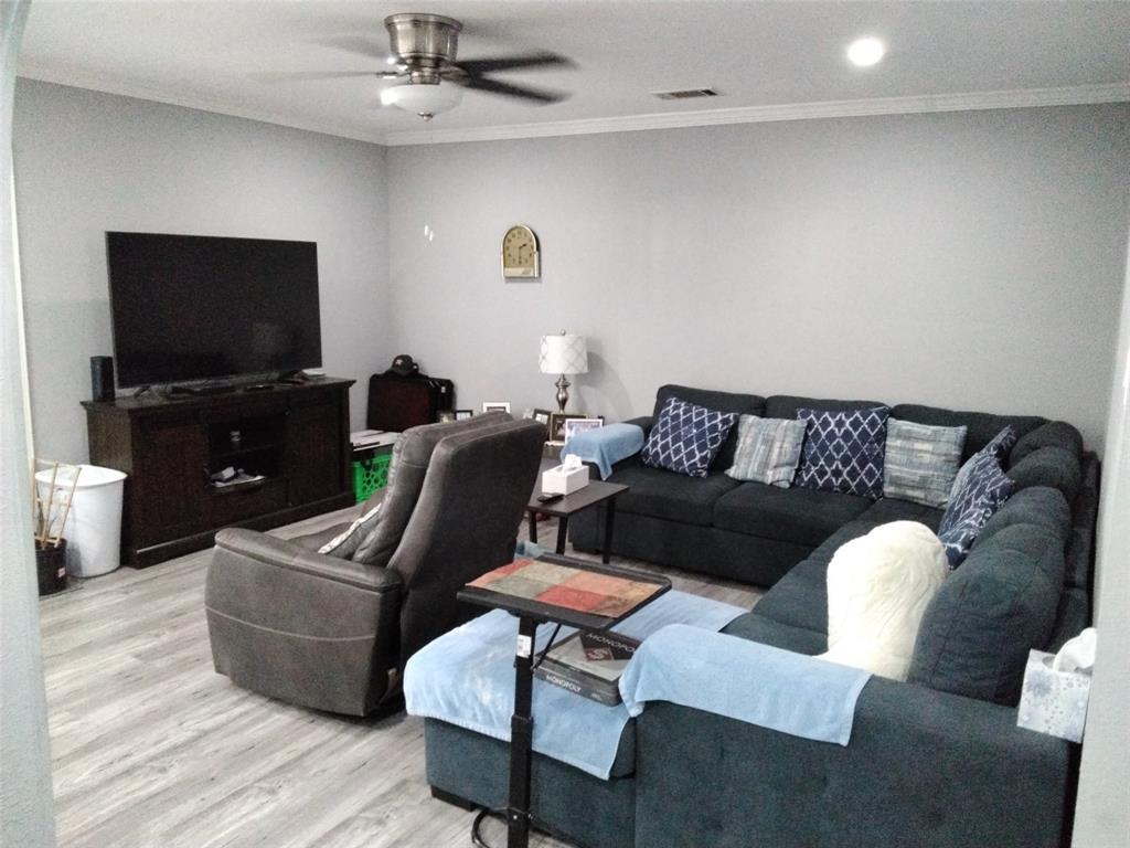 5036 Arbor Glen Road The Colony, TX 75056 - Photo 7 of 29 a living room with furniture and a flat screen tv