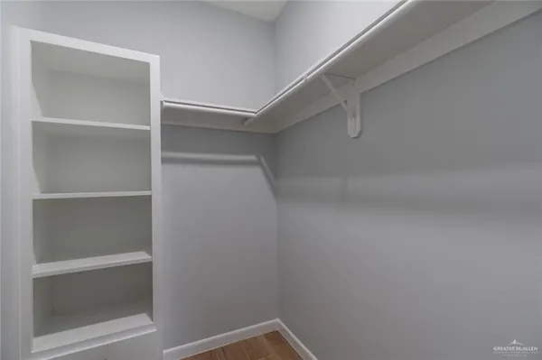 a view of an empty walk in closet