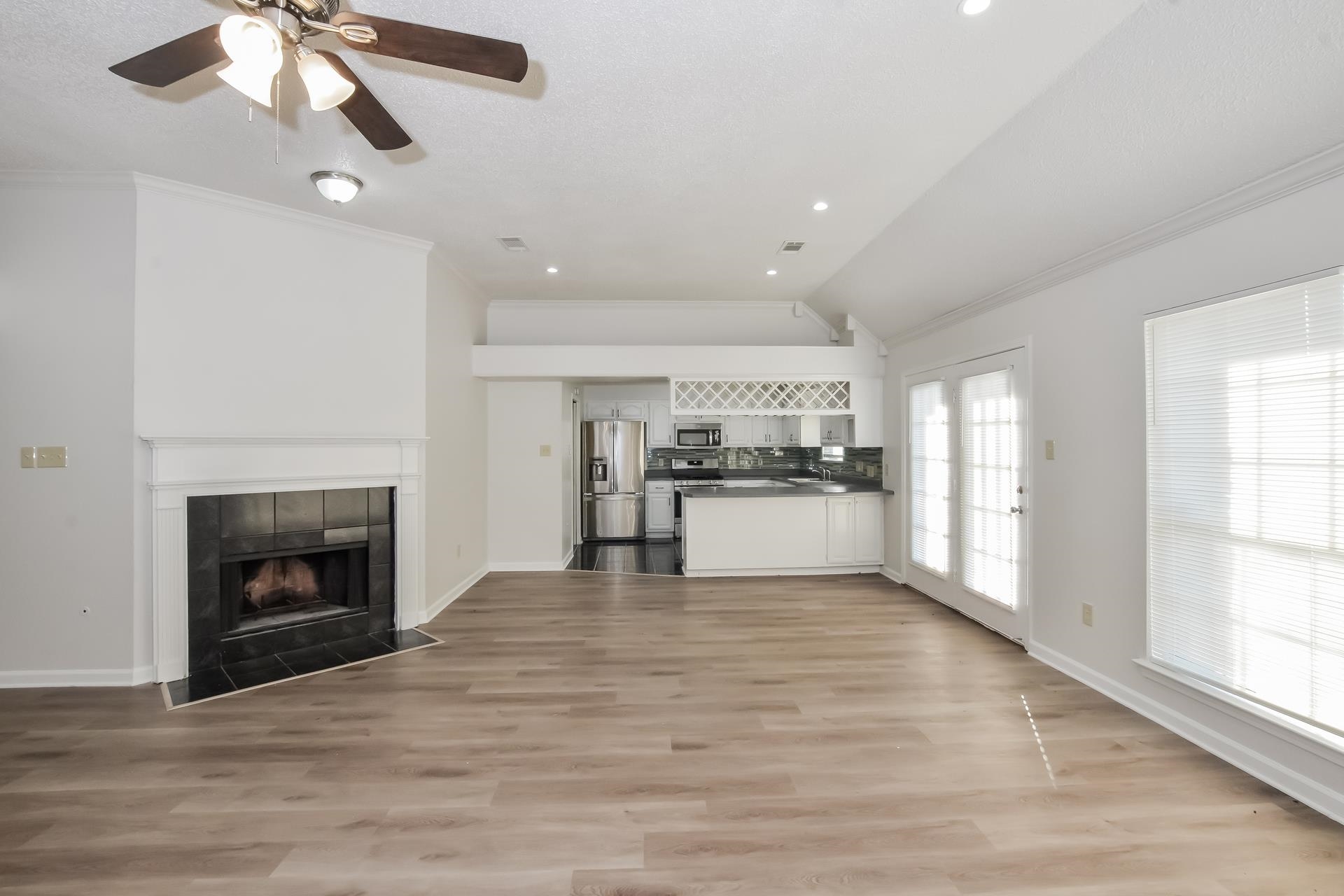 6650 Spencer Forest Cove West Memphis, TN 38141 - Photo 2 of 15 a view of an empty room with kitchen and fireplace