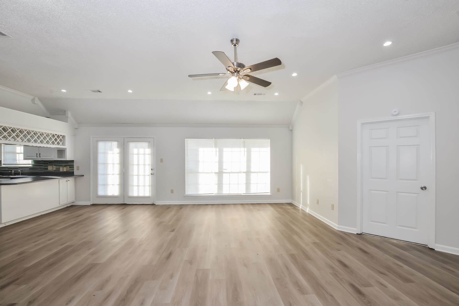 6650 Spencer Forest Cove West Memphis, TN 38141 - Photo 5 of 15 a view of an empty room with a window and wooden floor
