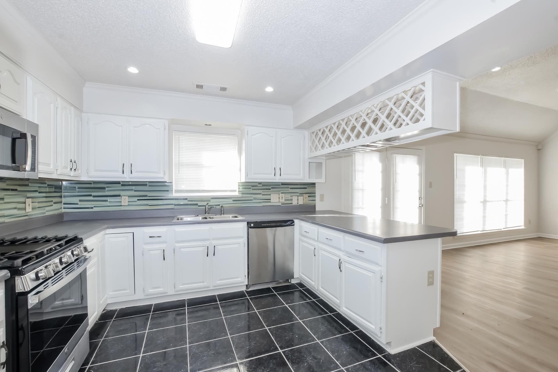 6650 Spencer Forest Cove West Memphis, TN 38141 - Photo 6 of 15 a kitchen with granite countertop stainless steel appliances a sink and cabinets