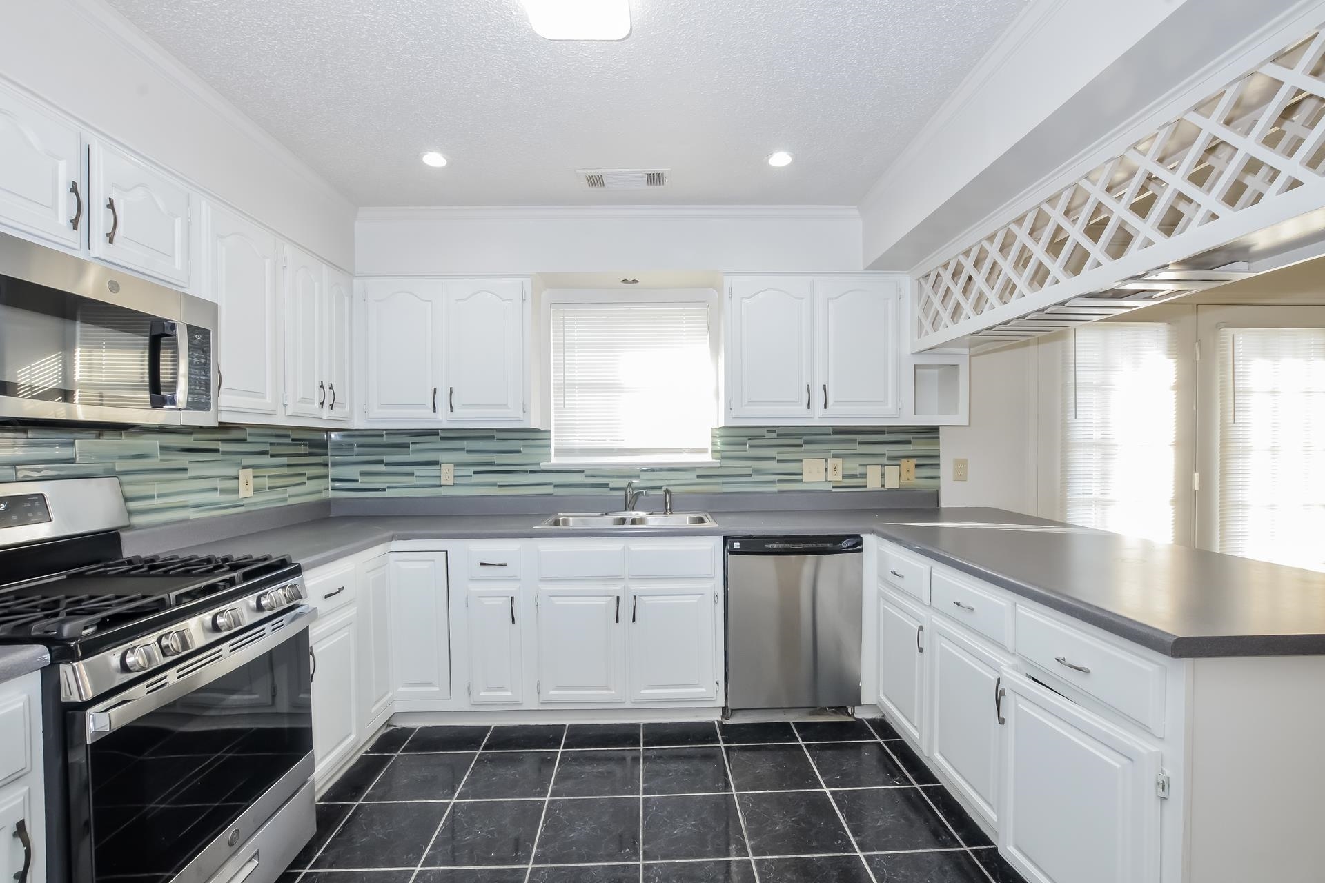 6650 Spencer Forest Cove West Memphis, TN 38141 - Photo 7 of 15 a kitchen with a stove sink and cabinets