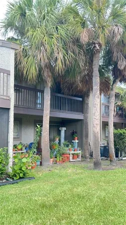 a front view of house with deck and outdoor seating