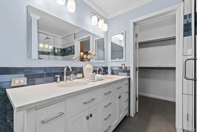 a spacious bedroom with a bed and a window