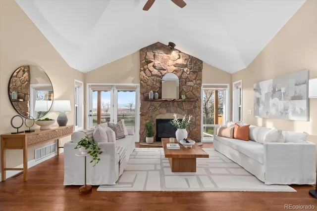 a living room with fireplace furniture and a chandelier
