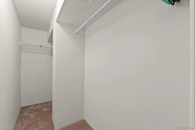 a aerial view of a house next to a yard