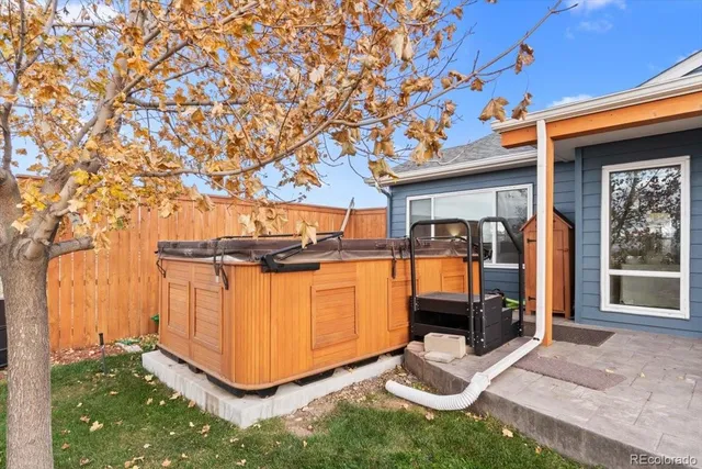 a view of a porch with wooden floor and fence