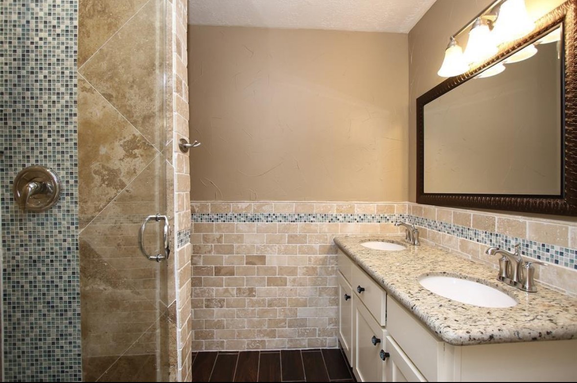 17810 Clearlight Lane Spring, TX 77379 - Photo 11 of 14 a bathroom with a granite countertop sink a mirror and shower