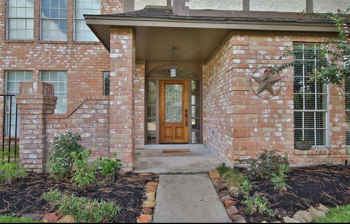 17810 Clearlight Lane Spring, TX 77379 - Photo 2 of 14 a front view of a house with a glass door