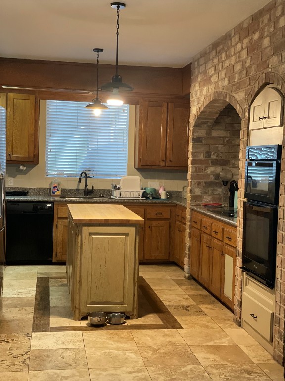 17810 Clearlight Lane Spring, TX 77379 - Photo 2 of 9 a kitchen with stainless steel appliances granite countertop a stove a sink and a microwave