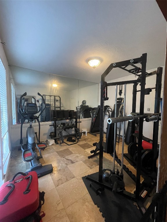 17810 Clearlight Lane Spring, TX 77379 - Photo 6 of 9 a room with gym equipment and a mirror