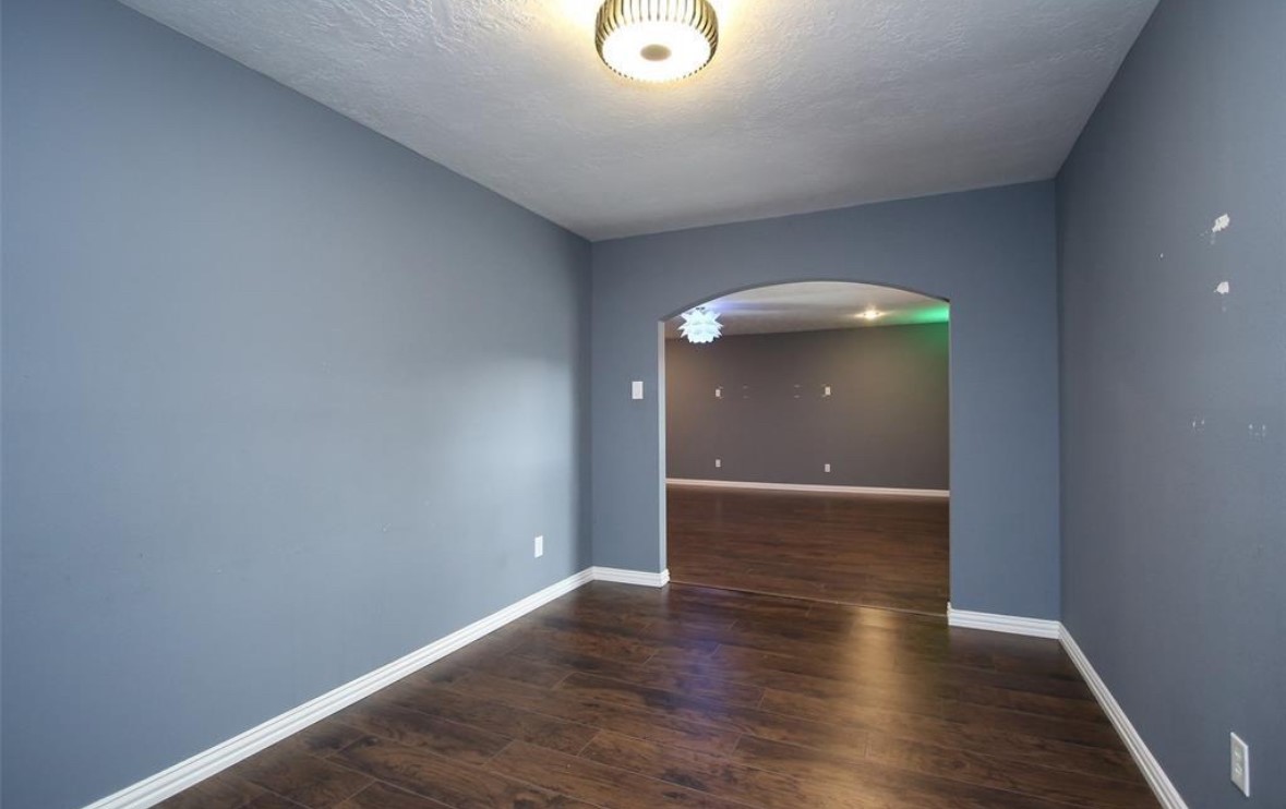 17810 Clearlight Lane Spring, TX 77379 - Photo 10 of 14 a view of an empty room with wooden floor
