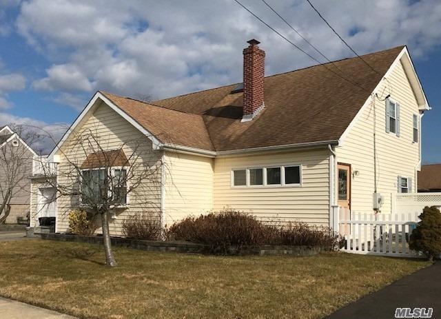 a front view of a house with garage