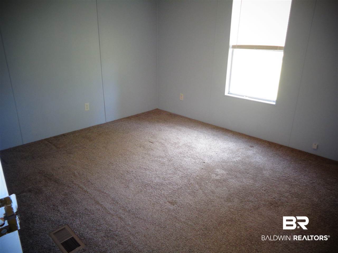 21535 A Glass And Spivey Road Robertsdale, AL 36567 - Photo 3 of 32 13x10. Carpet. Ceiling fan/light. Walk-in closet.