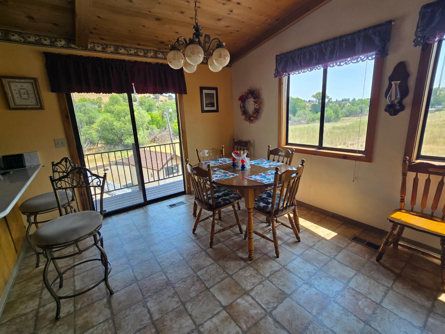 4204 Highway 263 Yreka, CA 96097 - Photo 19 of 66 a dining room with furniture a chandelier and wooden floor