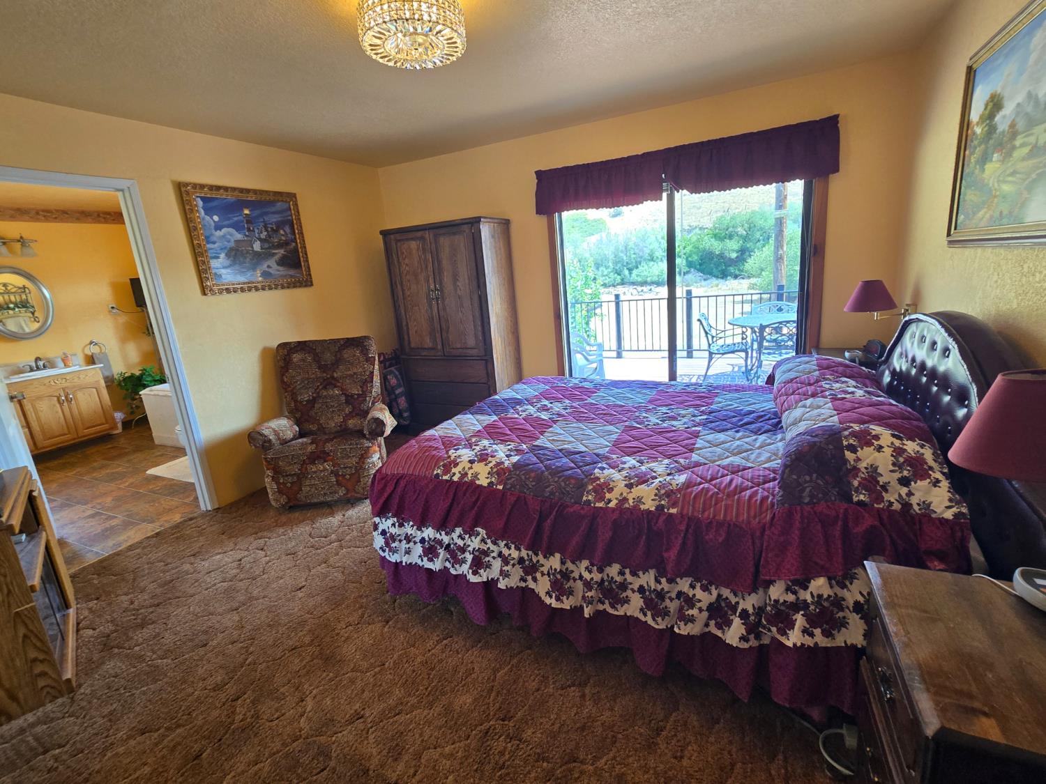 4204 Highway 263 Yreka, CA 96097 - Photo 22 of 66 a bed sitting in a bedroom next to a window