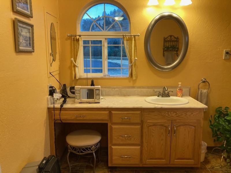 4204 Highway 263 Yreka, CA 96097 - Photo 25 of 66 a bathroom with a sink and a mirror