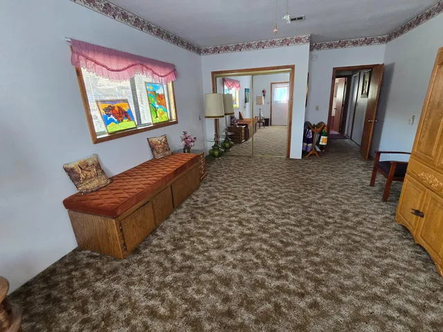 a view of an empty room with windows