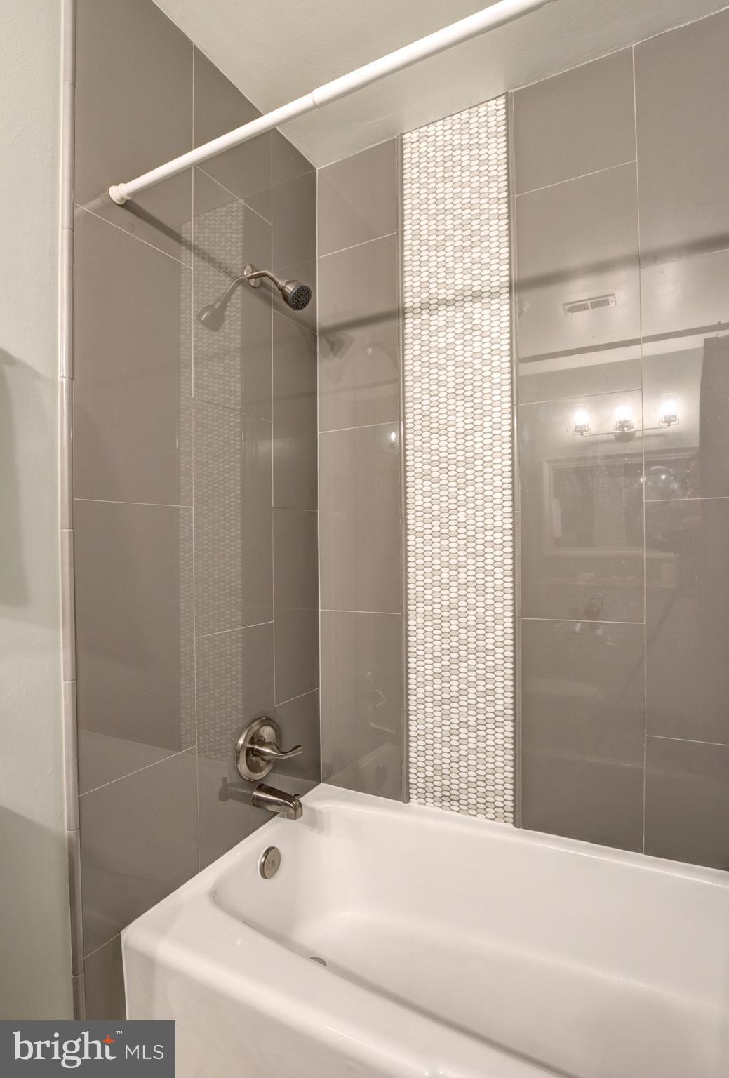 1535 Inlet Court Reston, VA 20190 - Photo 8 of 30 a bathroom with a bathtub and shower