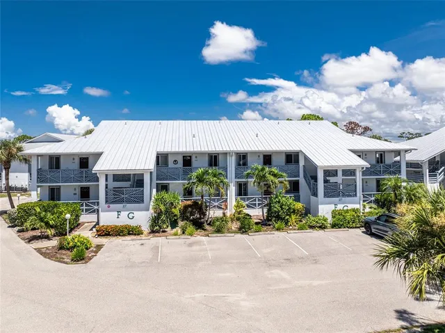 a front view of a house with lots of green space