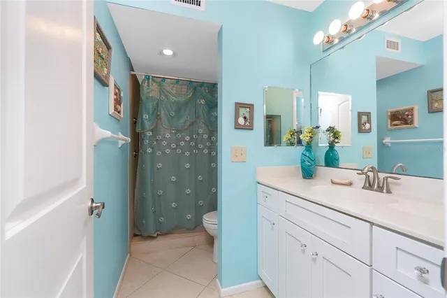 a bathroom with a sink a vanity and a mirror