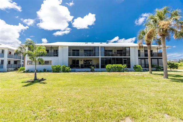 a view of a house with swimming pool and a porch