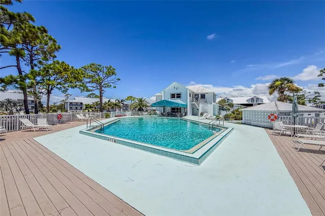 a view of a swimming pool with a lounge chairs
