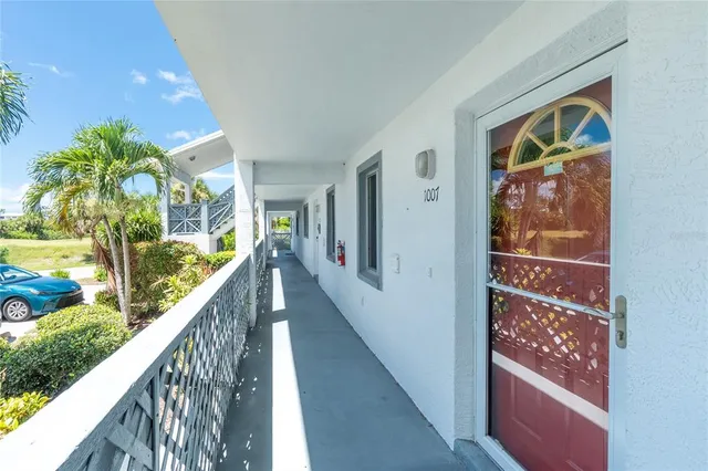 a view of balcony with wooden floor