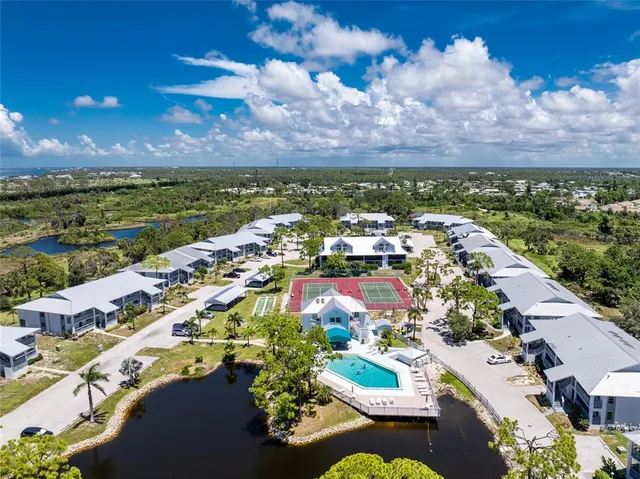 an aerial view of residential houses with outdoor space