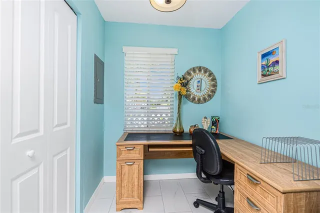 a workspace with furniture and a window