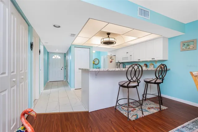 a view of entryway with wooden floor