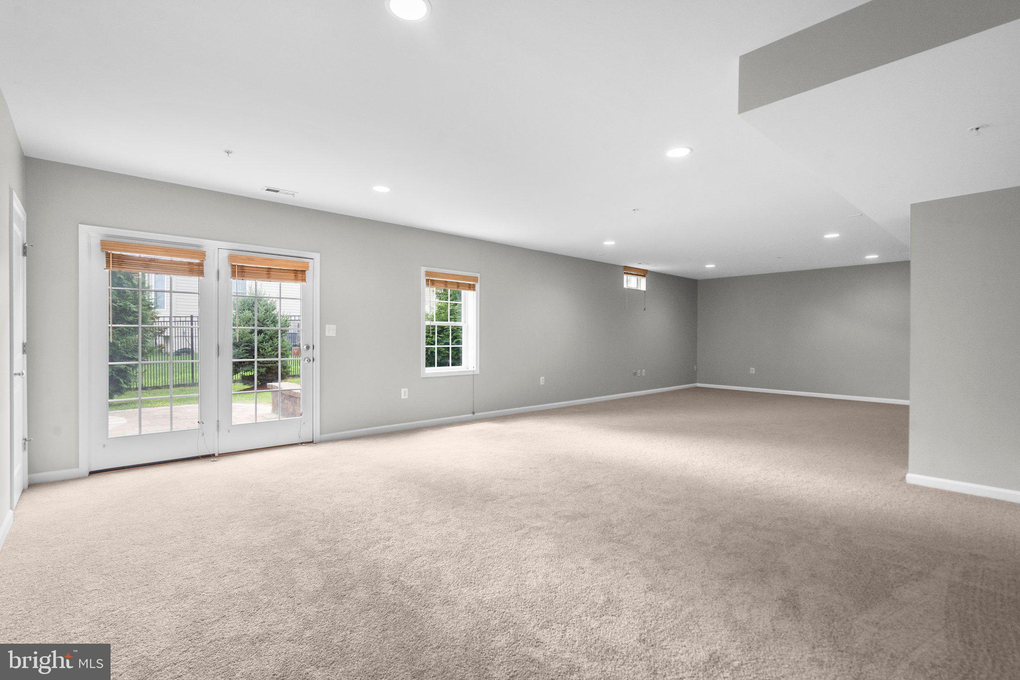 13221 Moonlight Trail Drive Silver Spring, MD 20906 - Photo 45 of 55 Recreation Room leading to backyard Patio