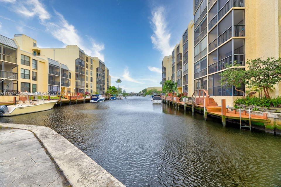9 Royal Palm Way, Unit 6030 Boca Raton, FL 33432 - Photo 2 of 17 a view of a lake with a building