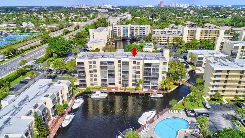 9 Royal Palm Way, Unit 6030 Boca Raton, FL 33432 - Photo 13 of 17 a view of swimming pool with outdoor seating and city view