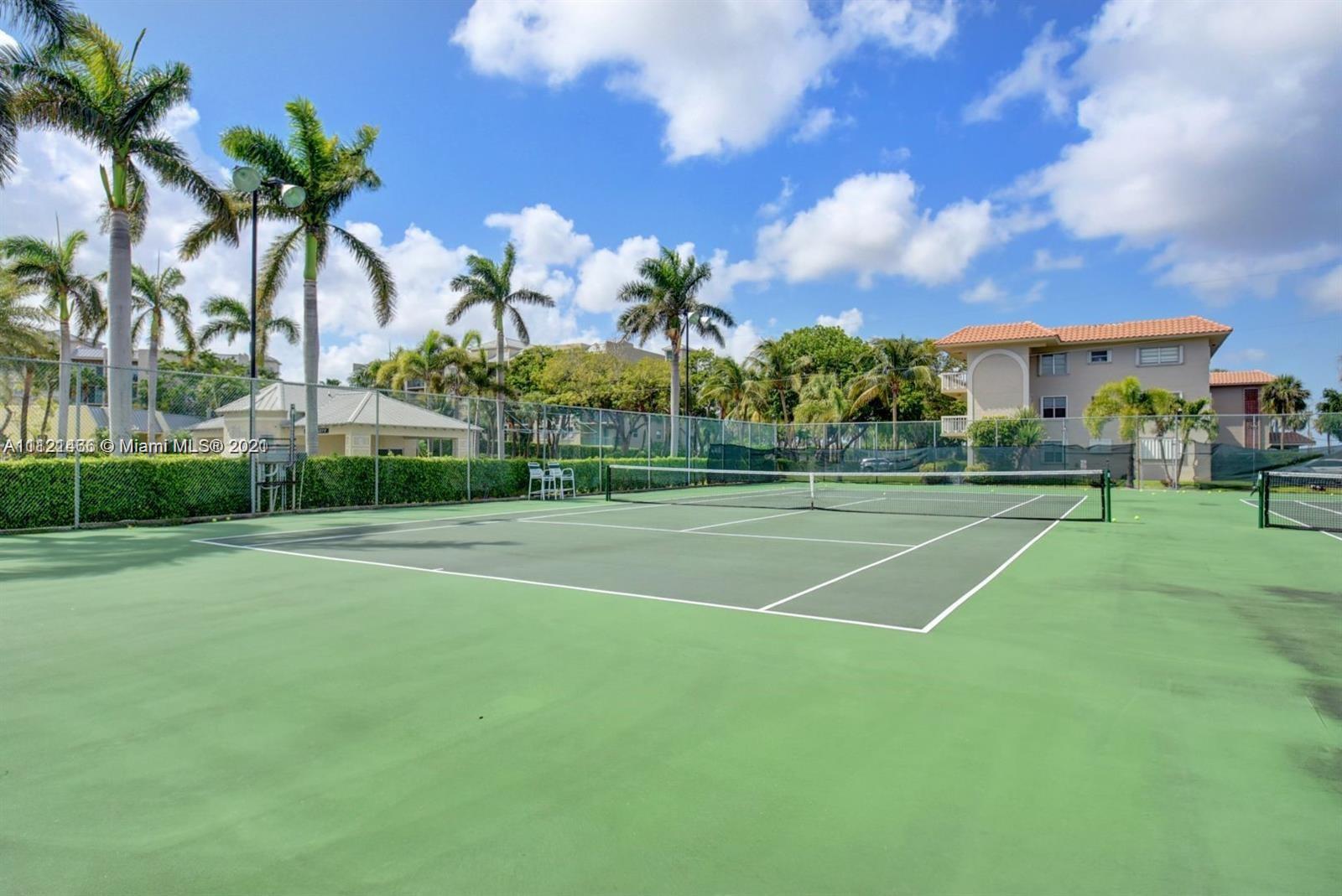9 Royal Palm Way, Unit 6030 Boca Raton, FL 33432 - Photo 16 of 17 a view of a playground and basketball court