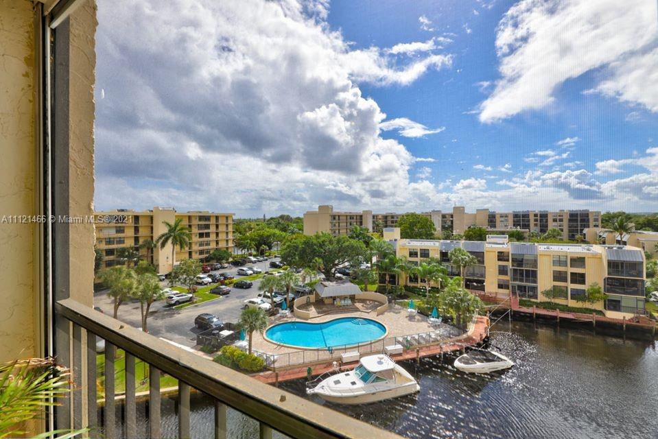 9 Royal Palm Way, Unit 6030 Boca Raton, FL 33432 - Photo 3 of 17 a view of a swimming pool with furniture