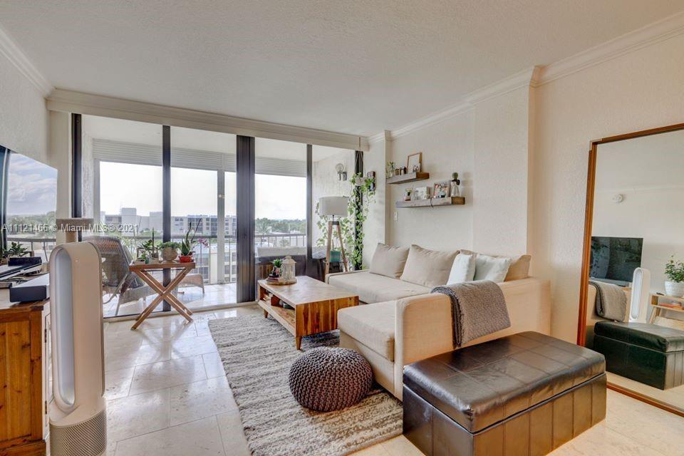 9 Royal Palm Way, Unit 6030 Boca Raton, FL 33432 - Photo 7 of 17 a living room with furniture and a floor to ceiling window