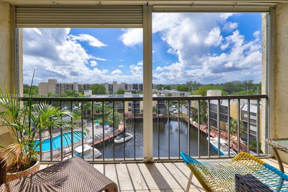 9 Royal Palm Way, Unit 6030 Boca Raton, FL 33432 - Photo 8 of 17 a view of a balcony with furniture and floor to ceiling window